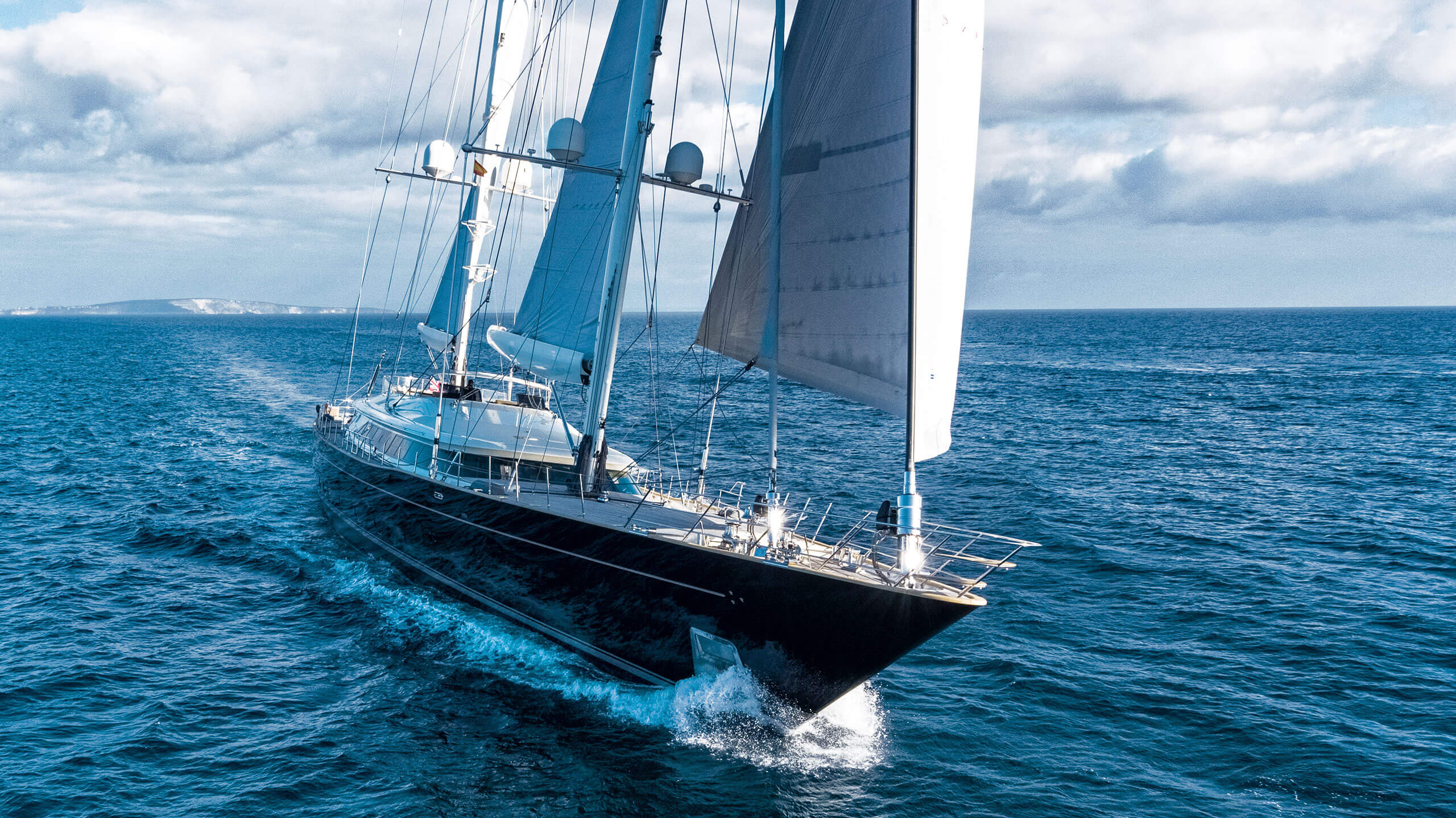yacht crashing on a wave