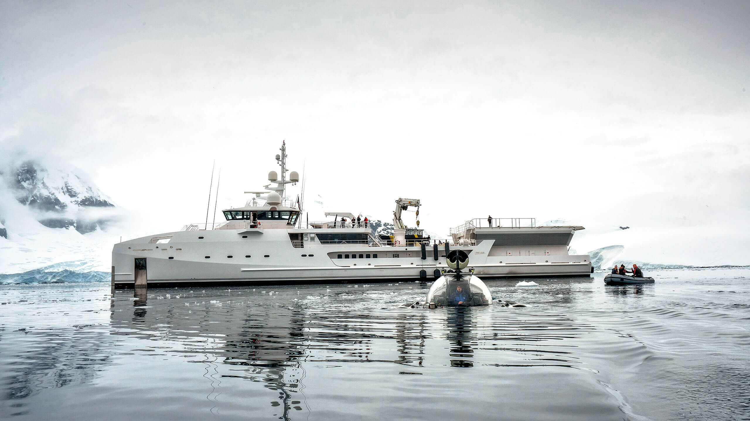 yacht near icebergs