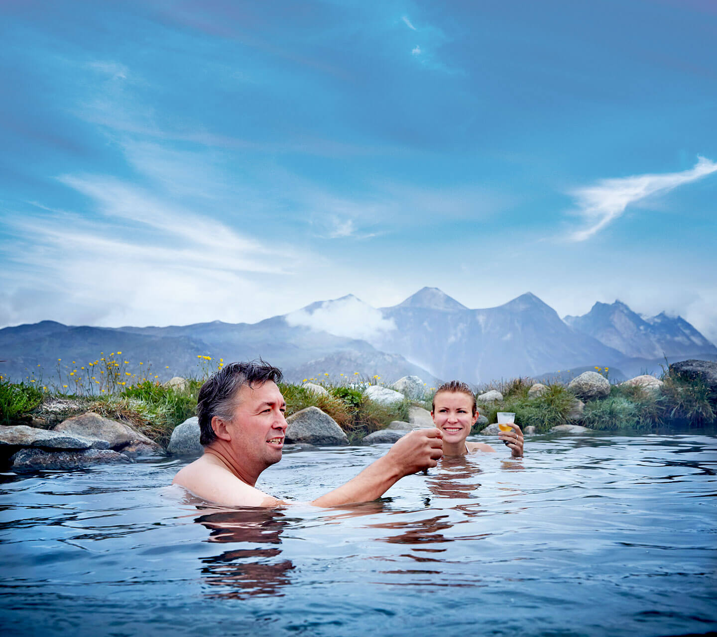 man and woman in spring water