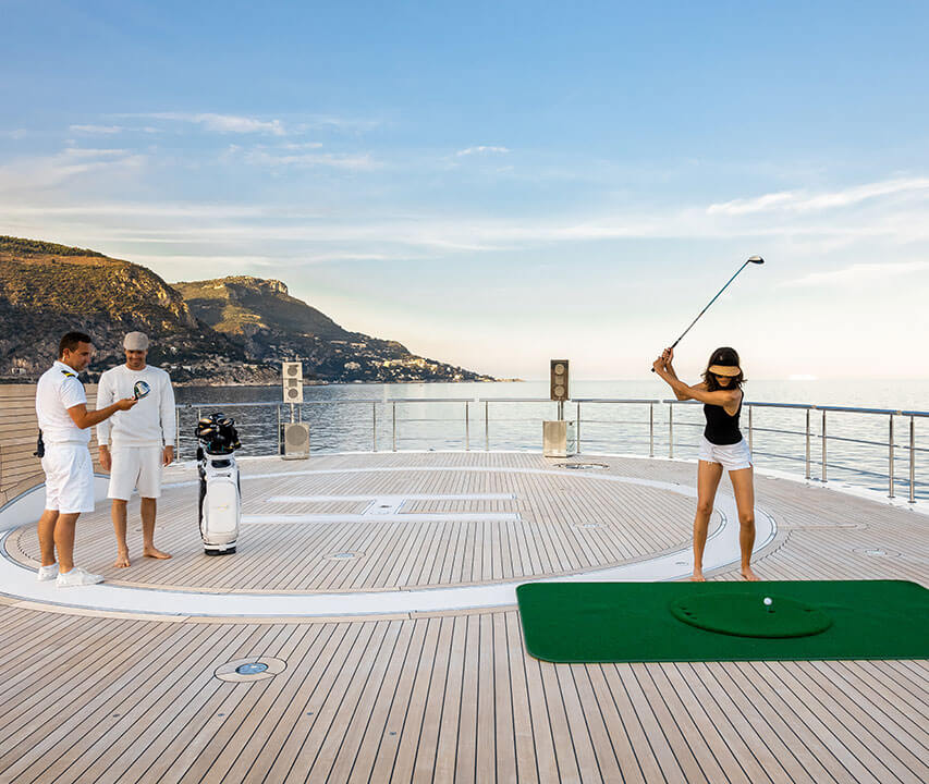 teeing off on a yacht